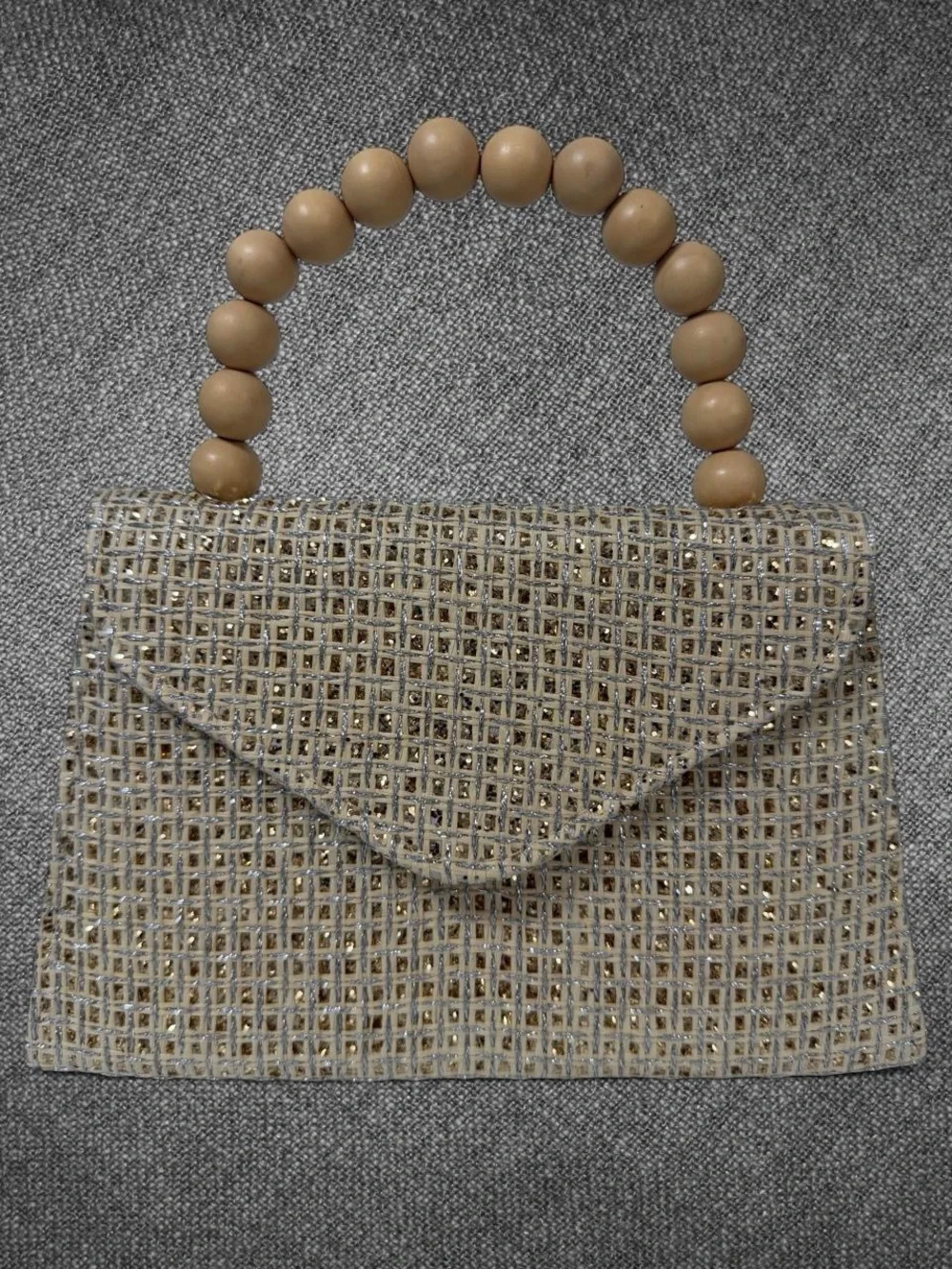Metallic Gold Woven Envelope Handbag With Wooden Bead Handle And Chain Strap